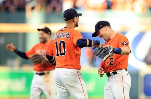 Alex Bregman and Yuli Gurriel of the Houston Astros congratulate each other after the final out as the Astros defeat the Chicago White Sox 9-4 to win...