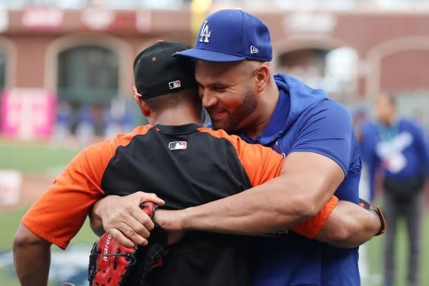 Albert Pujols of the Los Angeles Dodgers greets Donovan Solano of the San Francisco Giants prior to Game 1 of the National League Division Series at...