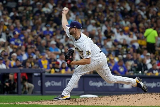 Adrian Houser of the Milwaukee Brewers pitches in the seventh inning during game 1 of the National League Division Series against the Atlanta Braves...