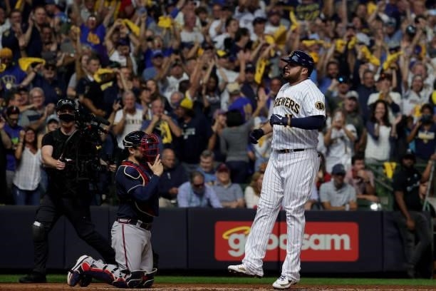Rowdy Tellez of the Milwaukee Brewers crosses home plate after hitting a home run in the seventh inning during game 1 of the National League Division...