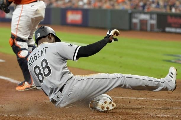 Luis Robert of the Chicago White Sox scores in the fifth inning against the Houston Astros during Game Two of the American League Division Series on...