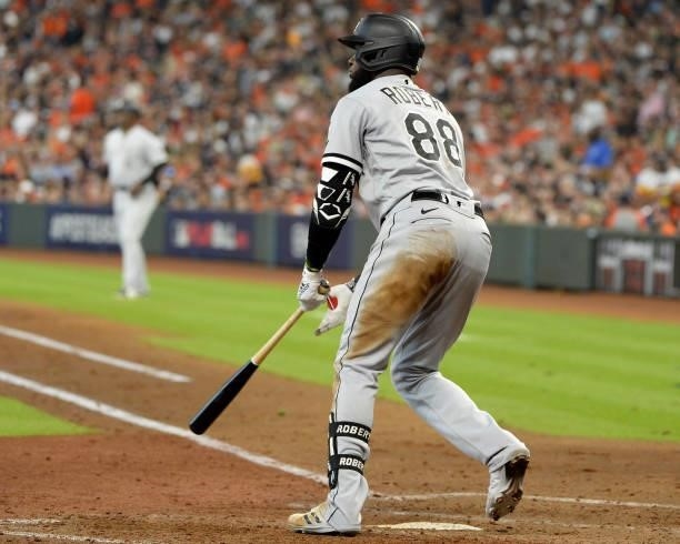 Luis Robert of the Chicago White Sox hits a single in the fifth inning against the Houston Astros during Game Two of the American League Division...