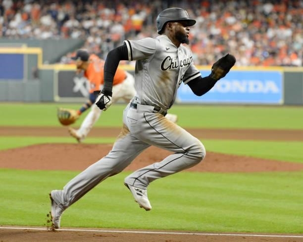 Luis Robert of the Chicago White Sox scores in the fifth inning against the Houston Astros during Game Two of the American League Division Series on...