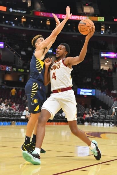 Chris Duarte of the Indiana Pacers tries to stop Evan Mobley of the Cleveland Cavaliers during the third quarter at Rocket Mortgage Fieldhouse on...