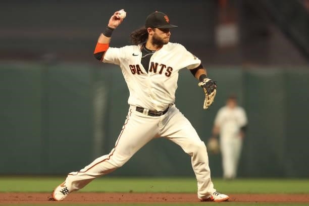 Brandon Crawford of the San Francisco Giants throws out Trea Turner of the Los Angeles Dodgers during the first inning of Game 1 of the National...