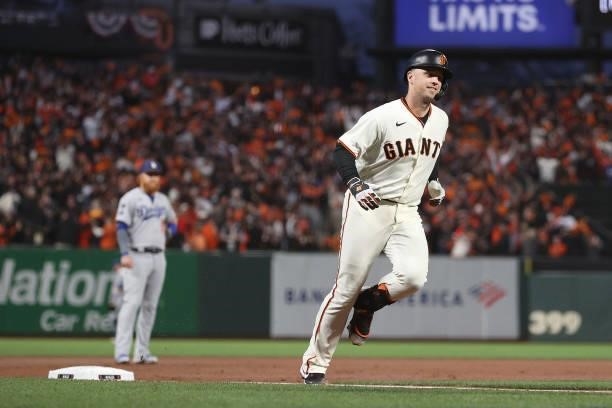 Buster Posey of the San Francisco Giants rounds the bases after hitting a two-run home run off Walker Buehler of the Los Angeles Dodgers during the...