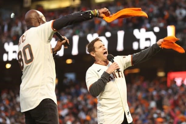 Hall of Fame receiver Jerry Rice and quarterback Steve Young pump up the crowd prior to Game 1 of the National League Division Series between the San...
