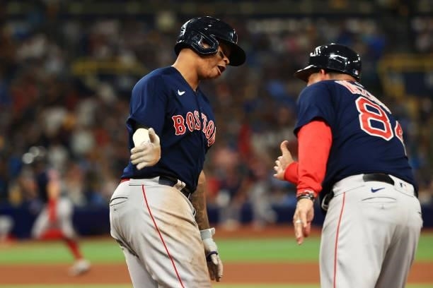 Rafael Devers of the Boston Red Sox celebrates his two-run homerun in the eighth inning against the Tampa Bay Rays during Game 2 of the American...