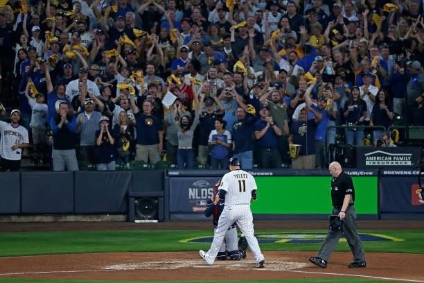 Fans react as Rowdy Tellez of the Milwaukee Brewers steps on home plate after hitting a two run home run in the seventh inning against the Atlanta...