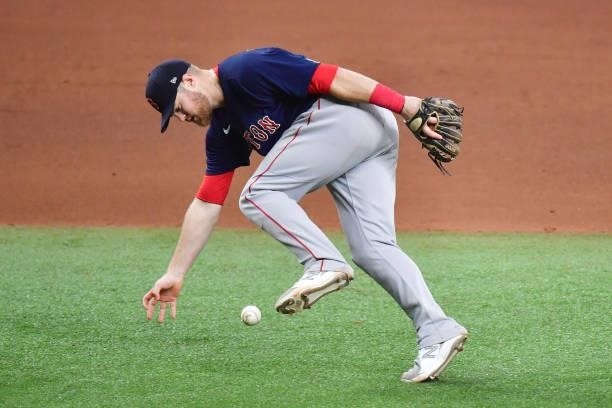 Christian Arroyo of the Boston Red Sox bobbles the ball on a single by Nelson Cruz of the Tampa Bay Rays in the eighth inning during Game 2 of the...