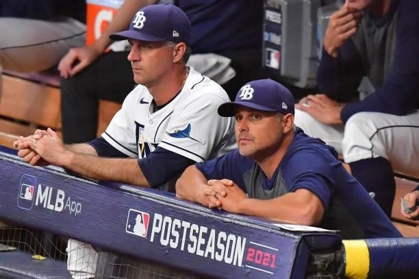 Kevin Cash of the Tampa Bay Rays looks on from the dugout during Game 2 of the American League Division Series against the Boston Red Sox at...