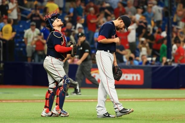 Matt Barnes and Christian Vazquez of the Boston Red Sox celebrate their 14 to 6 win over the Tampa Bay Rays during Game 2 of the American League...