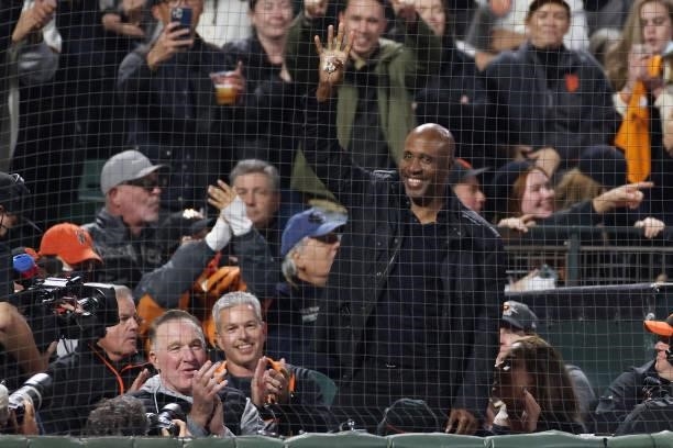 Former San Francisco Giants player Barry Bonds waves to the crowd as he is introduced during the fifth inning of Game 1 of the National League...