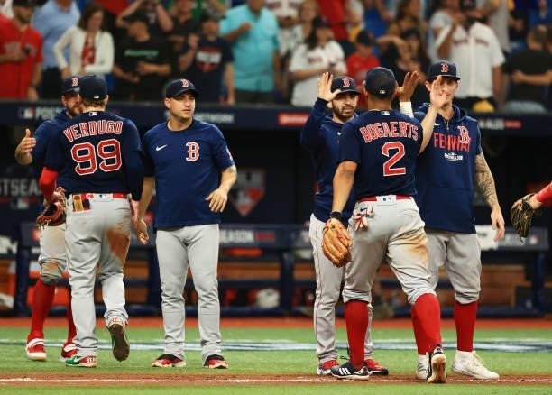The Boston Red Sox celebrate their 14 to 6 win over the Tampa Bay Rays during Game 2 of the American League Division Series at Tropicana Field on...