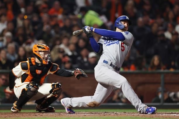 Corey Seager of the Los Angeles Dodgers hits a double against the San Francisco Giants during the sixth inning of Game 1 of the National League...