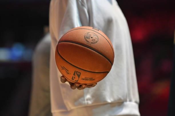 Member of the Indiana Pacers holds an official NBA basketball during a timeout during the fourth quarter against the Cleveland Cavaliers at Rocket...