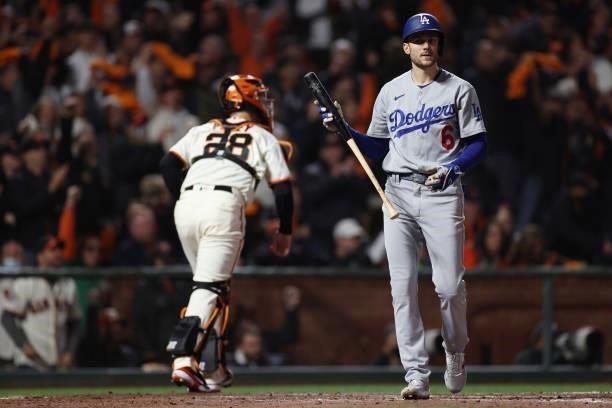 Trea Turner of the Los Angeles Dodgers reacts after striking out against the San Francisco Giants during the sixth inning of Game 1 of the National...