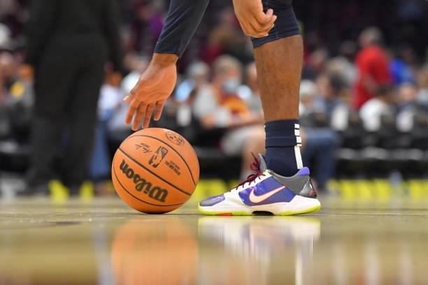 Brad Wanamaker o the Indiana Pacers reaches for an official NBA basketball as it sits on the court during a timeout during the third quarter against...