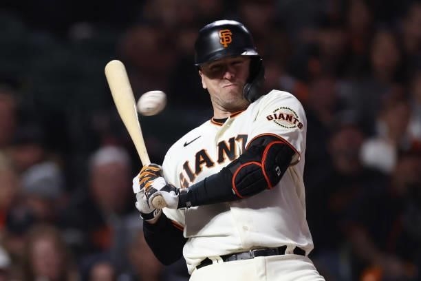 Buster Posey of the San Francisco Giants avoids a inside pitch from Walker Buehler of the Los Angeles Dodgers during the sixth inning of Game 1 of...