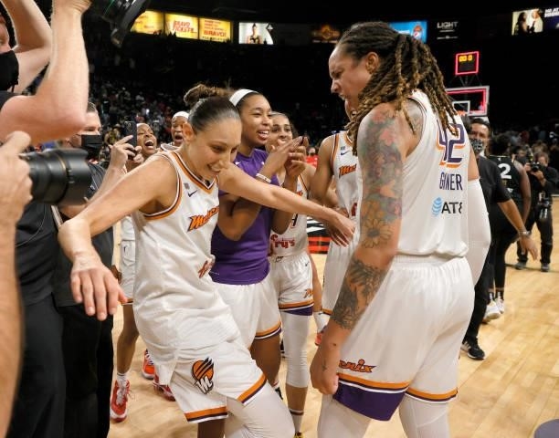 Diana Taurasi and Brittney Griner of the Phoenix Mercury celebrate after the Mercury defeated the Las Vegas Aces 87-84 in Game Five of the 2021 WNBA...