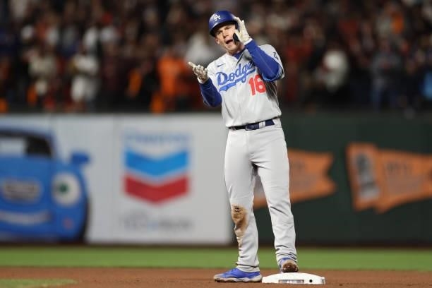 Will Smith of the Los Angeles Dodgers celebrates after hitting a double against the San Francisco Giants during the seventh inning of Game 1 of the...