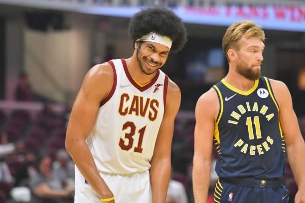 Jarrett Allen of the Cleveland Cavaliers jokes with Domantas Sabonis of the Indiana Pacers during the first quarter at Rocket Mortgage Fieldhouse on...
