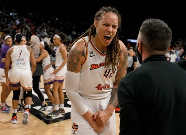 Brittney Griner of the Phoenix Mercury celebrates with Mercury President Vince Kozar after the team defeated the Las Vegas Aces 87-84 in Game Five of...