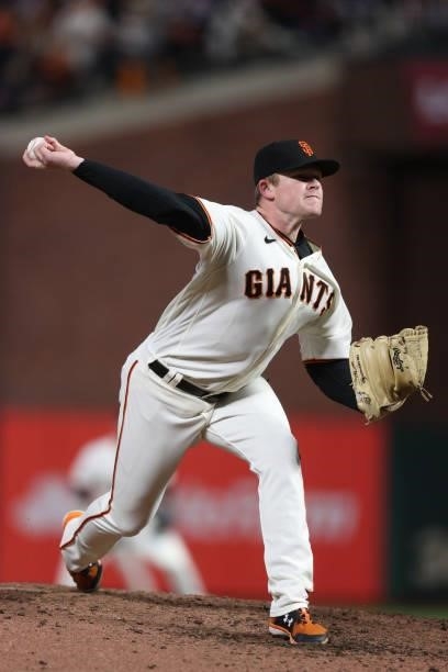 Logan Webb of the San Francisco Giants delivers a pitch against the Los Angeles Dodgers during the seventh inning of Game 1 of the National League...