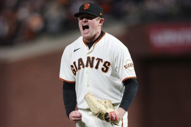 Logan Webb of the San Francisco Giants reacts after striking out Cody Bellinger of the Los Angeles Dodgers during the seventh inning of Game 1 of the...