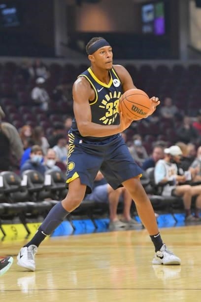 Myles Turner of the Indiana Pacers passes during the first quarter against the Cleveland Cavaliers at Rocket Mortgage Fieldhouse on October 08, 2021...