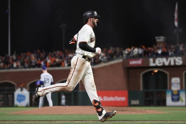 Kris Bryant of the San Francisco Giants rounds the bases after hitting a solo home run off Walker Buehler of the Los Angeles Dodgers during the...