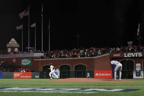Kris Bryant of the San Francisco Giants rounds the bases after hitting a solo home run off Walker Buehler of the Los Angeles Dodgers during the...