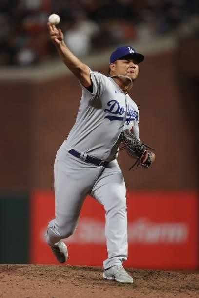 Brusdar Graterol of the Los Angeles Dodgers delivers a pitch against the San Francisco Giants during the seventh inning of Game 1 of the National...