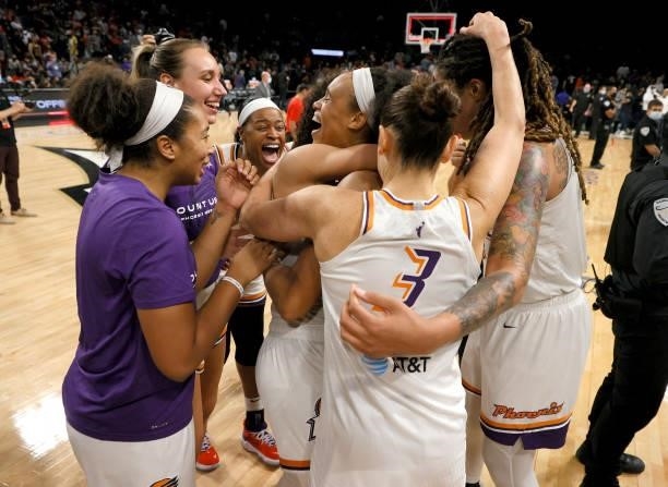 The Phoenix Mercury celebrate after defeating the Las Vegas Aces 87-84 in Game Five of the 2021 WNBA Playoffs semifinals to win the series at...