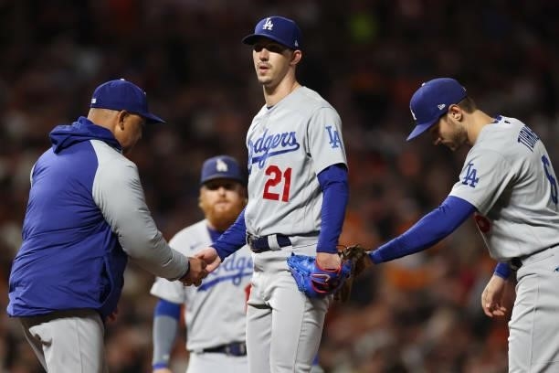 Manager Dave Roberts of the Los Angeles Dodgers removes Walker Buehler from the game against the San Francisco Giants during the seventh inning of...