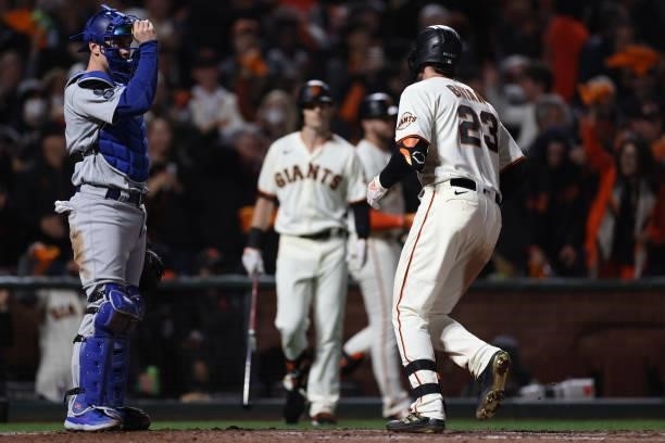 Kris Bryant of the San Francisco Giants crosses home plate after hitting a solo home run off Walker Buehler of the Los Angeles Dodgers during the...