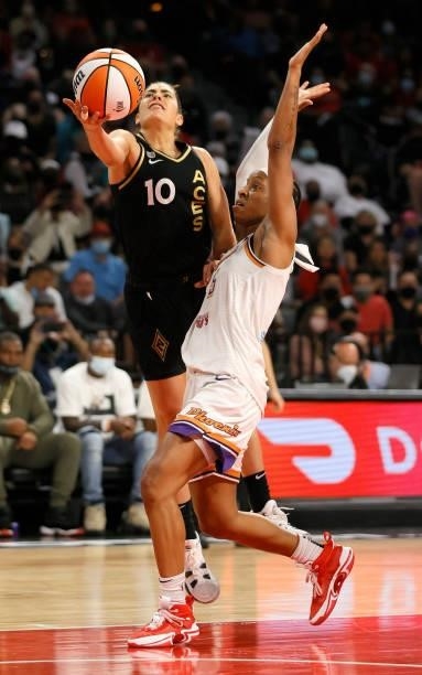 Kelsey Plum of the Las Vegas Aces is fouled as she drives to the basket by Shey Peddy of the Phoenix Mercury during Game Five of the 2021 WNBA...