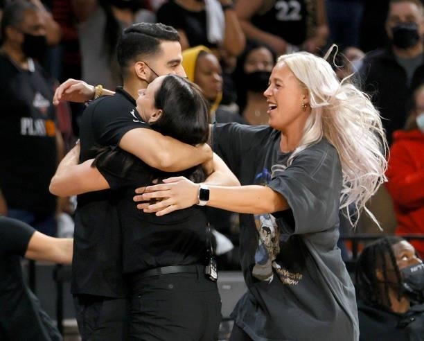 Player development coach Zach O'Brien, head coach Sandy Brondello and Sophie Cunningham of the Phoenix Mercury celebrate after the team defeated the...