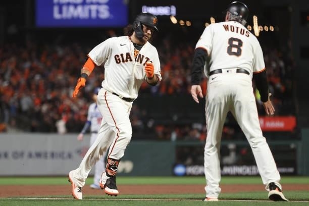 Brandon Crawford of the San Francisco Giants rounds the bases after hitting a solo home run off Alex Vesia of the Los Angeles Dodgers during the...