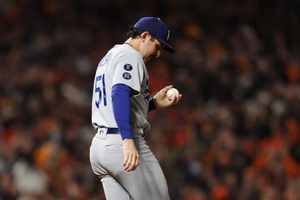Alex Vesia of the Los Angeles Dodgers reacts after allowing a solo home run to Brandon Crawford of the San Francisco Giants during the eighth inning...