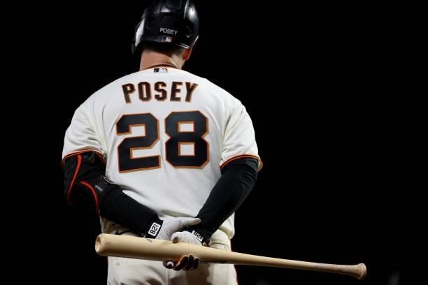 Buster Posey of the San Francisco Giants looks on against the Los Angeles Dodgers during the eighth inning of Game 1 of the National League Division...
