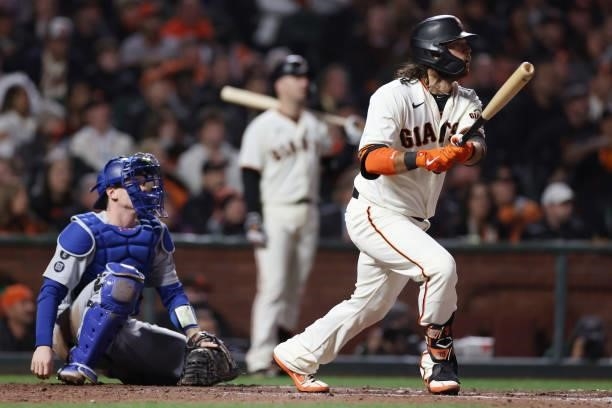 Brandon Crawford of the San Francisco Giants hits a solo home run off Alex Vesia of the Los Angeles Dodgers during the eighth inning of Game 1 of the...