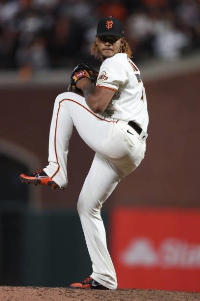 Camilo Doval of the San Francisco Giants delivers a pitch against the Los Angeles Dodgers during the ninth inning of Game 1 of the National League...