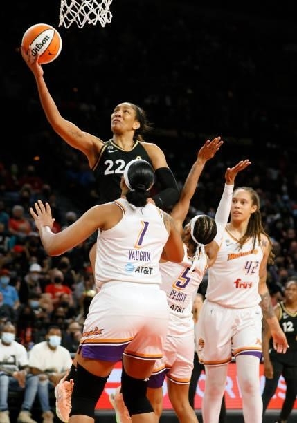 Ja Wilson of the Las Vegas Aces drives to the basket against Kia Vaughn and Shey Peddy of the Phoenix Mercury during Game Five of the 2021 WNBA...
