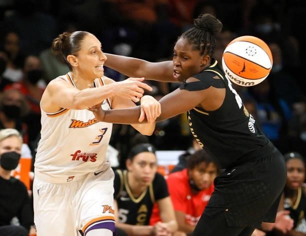 Diana Taurasi of the Phoenix Mercury passes against Chelsea Gray of the Las Vegas Aces during Game Five of the 2021 WNBA Playoffs semifinals at...