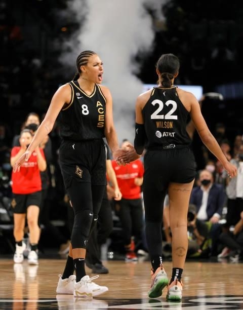 Liz Cambage and A'ja Wilson of the Las Vegas Aces celebrate after Wilson scored against the Phoenix Mercury during Game Five of the 2021 WNBA...
