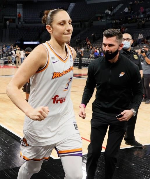 Diana Taurasi of the Phoenix Mercury and Mercury President Vince Kozar run off the court after the team's 87-84 victory over the Las Vegas Aces in...