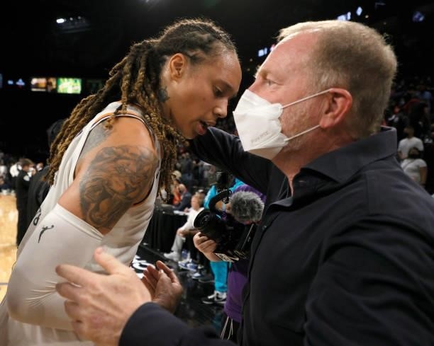 Brittney Griner of the Phoenix Mercury celebrates with Phoenix Suns and Mercury owner Robert Sarver after the team defeated the Las Vegas Aces 87-84...