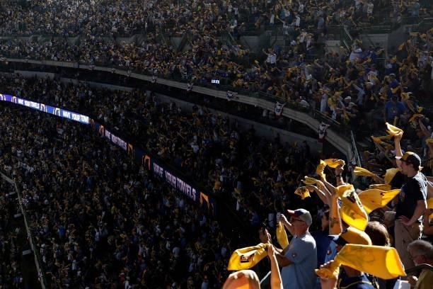 Brewer fans wave the yellow towel during Game One of the National League division series at American Family Field on October 08, 2021 in Milwaukee,...