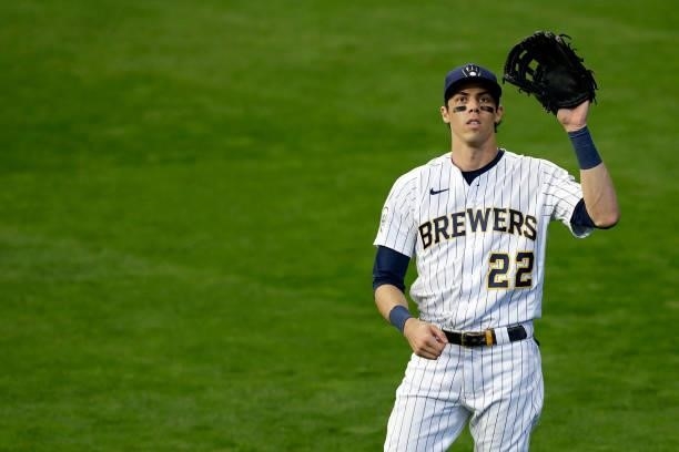 Christian Yelich of the Milwaukee Brewers warms up between innings against the Atlanta Braves in the sixth inning during Game One of the National...